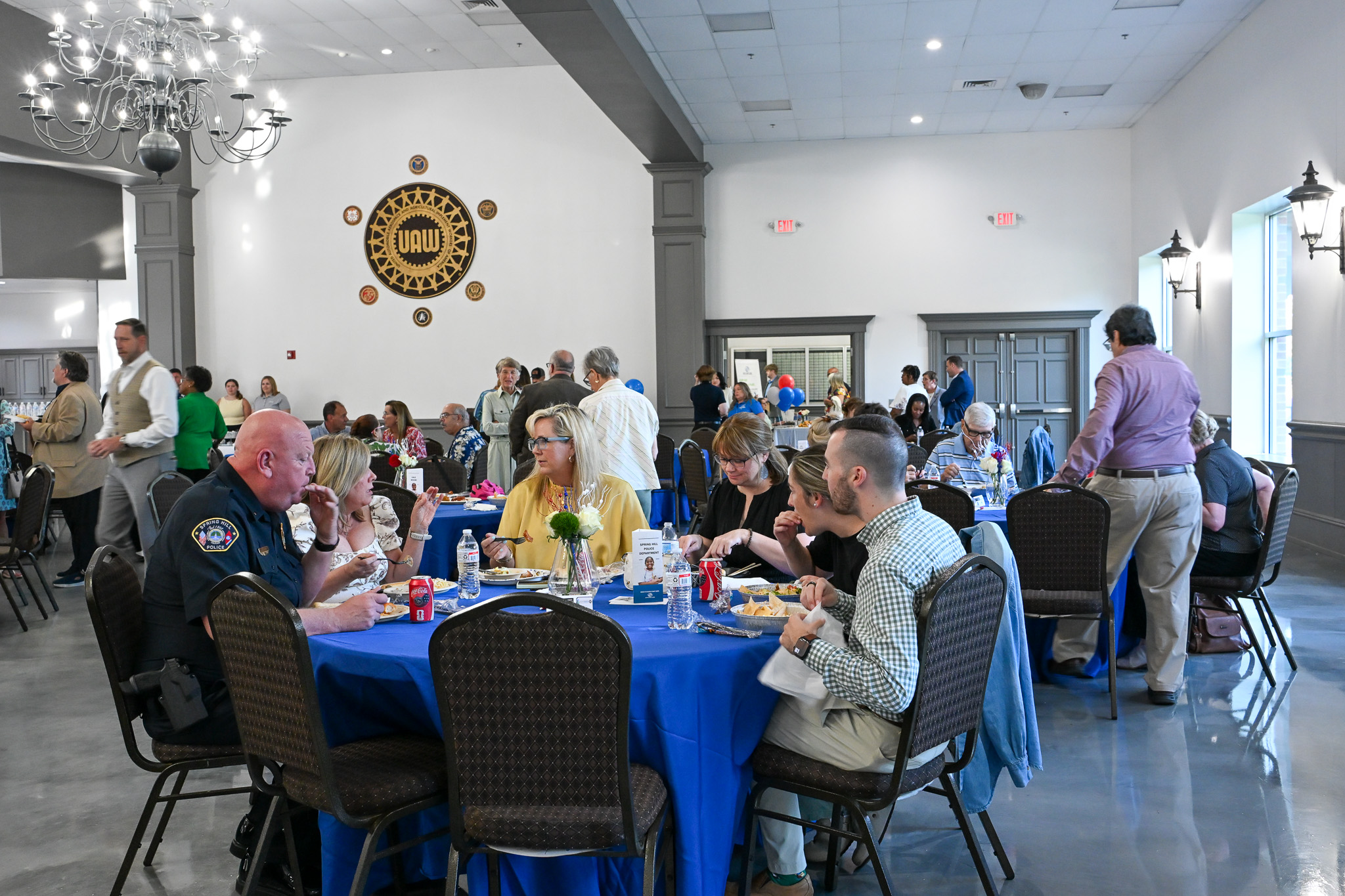 Attendees sit around a table and enjoy dinner during the 2026 Spring Hill Hero of the Year Celebration.