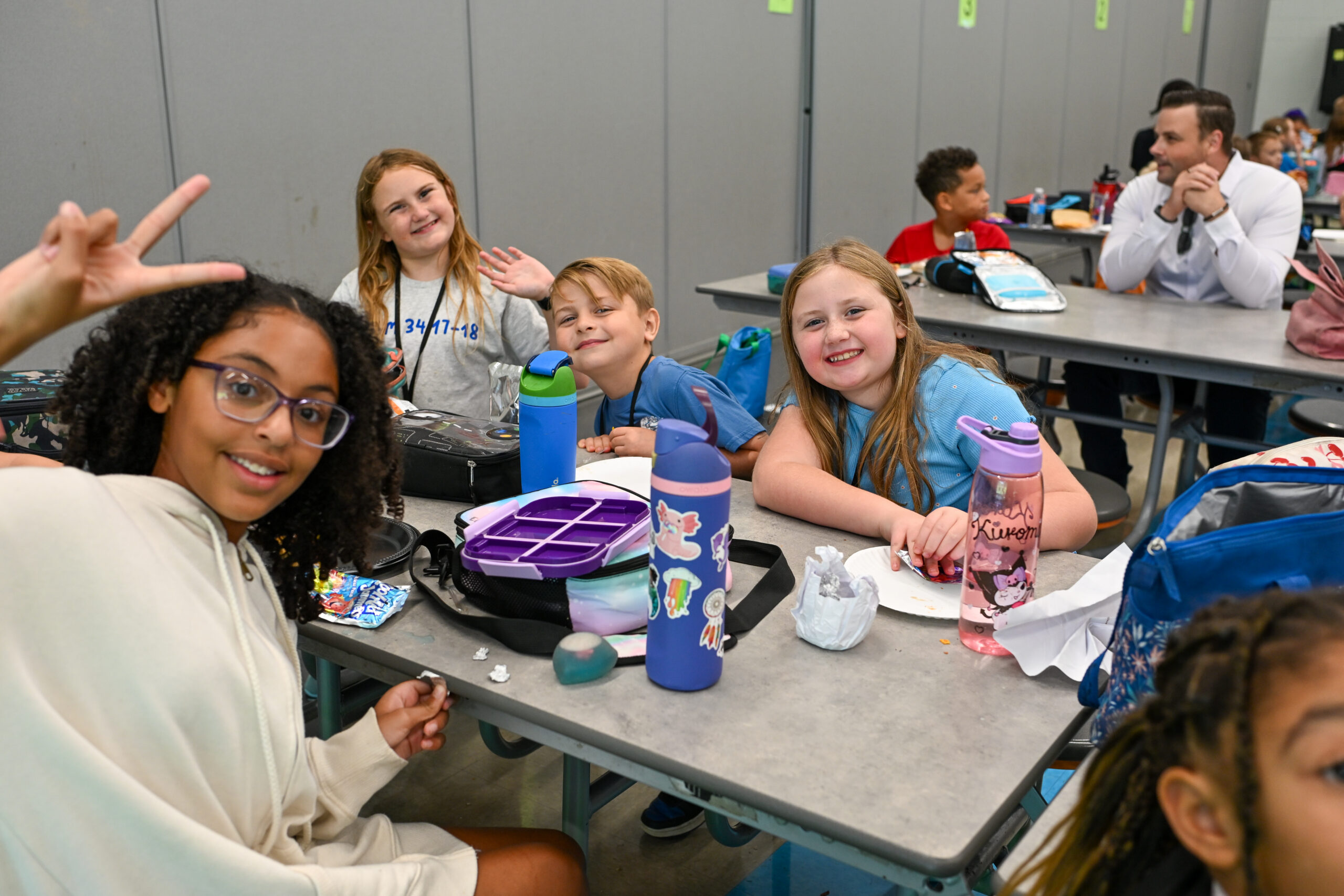 Spring Hill Club kids pose together for a photo during lunch.