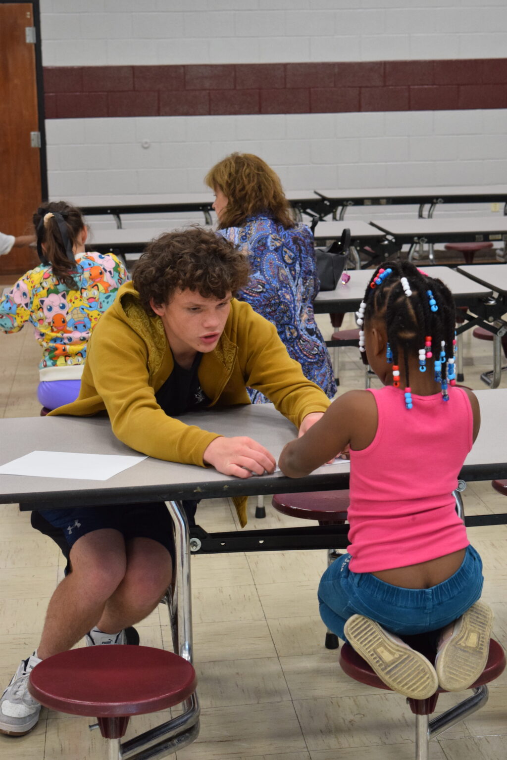 Pictured: Volunteer reading to BGCSCTN club member at Spring Hill Elementary Schoo