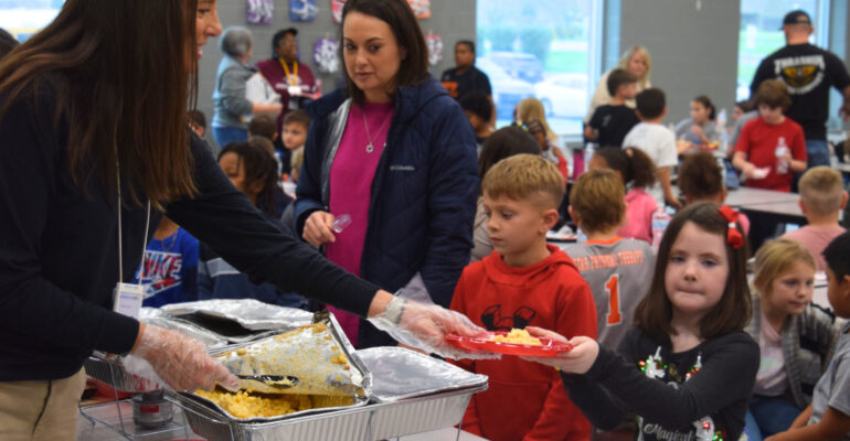 BGCSCTN Thanksgiving 2024 Volunteers serving children hot meals