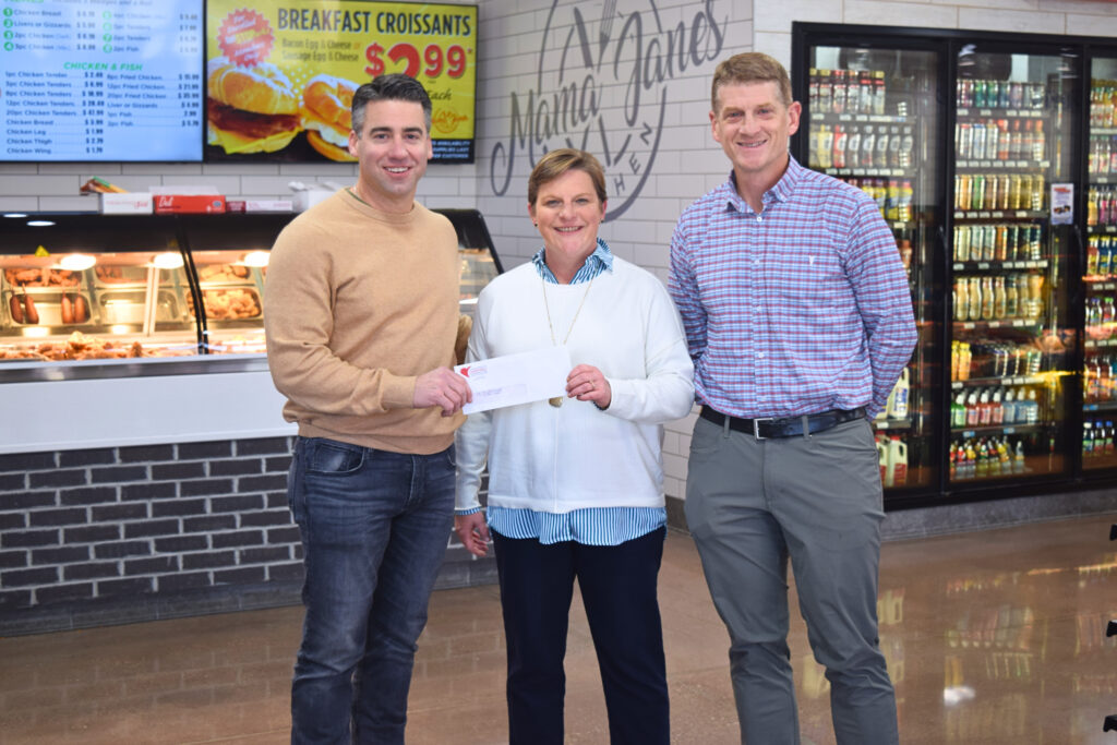 Seth Blanks, CEO of Highland Corporation and Russ Adcox, Highland Board of Directors and Pastor at Maury Hills Church, present a donation to Ginny Wright , CEO of BGCSCTN) 