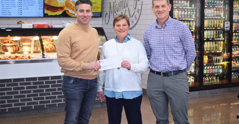 Seth Blanks, CEO of Highland Corporation and Russ Adcox, Highland Board of Directors and Pastor at Maury Hills Church, present a donation to Ginny Wright , CEO of BGCSCTN) 