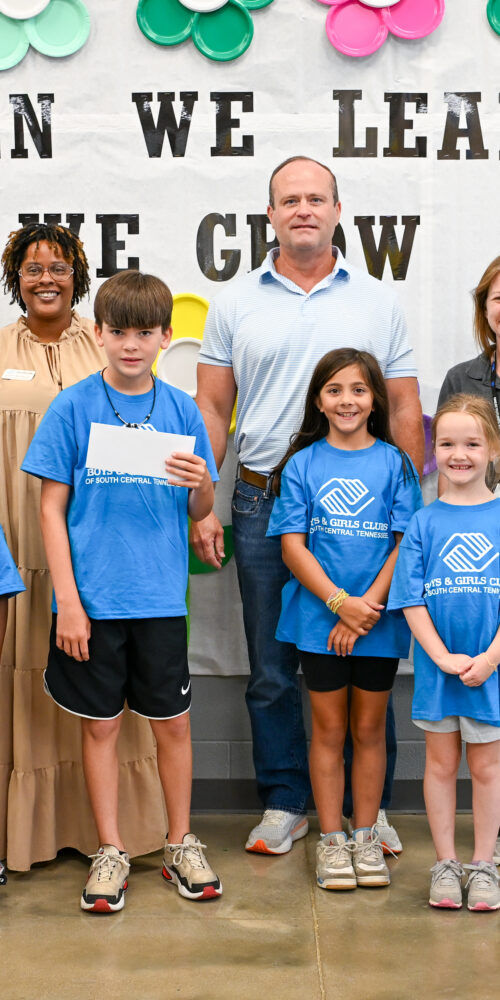 BGCSCTN staff and Club members pose with the Ole South Builders team during a check presentation at Battle Creek Elementary School in Spring Hill.